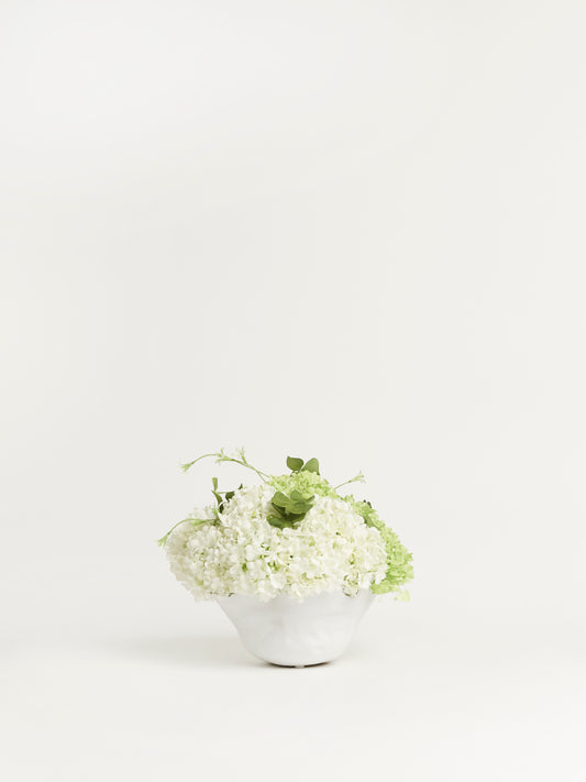 White Ceramic Vase with White and Green Snowball Flowers